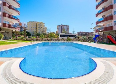 Large apartment in a complex in the center of Mahmutlar, Alanya ID-0168 фото-1