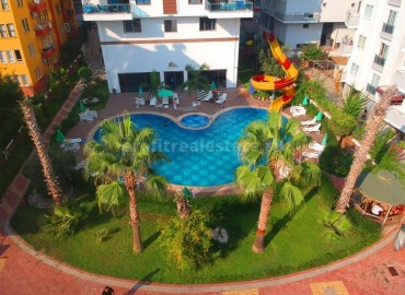 Двухкомнатная квартира на первом высоком этаже в Махмутлар, Алания ID-4162 фото-1