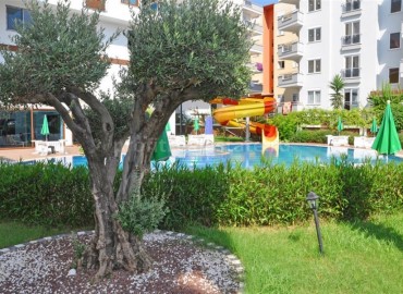 Двухкомнатная квартира на первом высоком этаже в Махмутлар, Алания ID-4162 фото-14